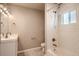 Bathroom featuring tile shower and flooring with vanity and bright natural light at 4804 N Raleigh St, Denver, CO 80212