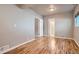 Bedroom featuring wood floors with views to the bath through a doorway at 4804 N Raleigh St, Denver, CO 80212