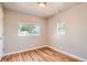 Bedroom featuring wood floors and natural light at 4804 N Raleigh St, Denver, CO 80212