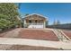 Charming home exterior featuring a cozy front porch and landscaped front yard at 4804 N Raleigh St, Denver, CO 80212