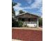 Charming bungalow with covered porch and red mulch landscaping at 4804 N Raleigh St, Denver, CO 80212