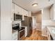 Modern kitchen with stainless steel appliances and white cabinets at 4804 N Raleigh St, Denver, CO 80212