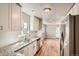Bright, updated kitchen with granite countertops and subway tile backsplash at 4804 N Raleigh St, Denver, CO 80212