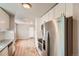 Modern kitchen featuring stainless appliances, granite countertops and new white cabinets at 4804 N Raleigh St, Denver, CO 80212