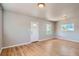 Cozy living room with hardwood floors, white trim, and natural light at 4804 N Raleigh St, Denver, CO 80212