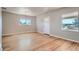 Bright living room with hardwood floors and two windows at 4804 N Raleigh St, Denver, CO 80212
