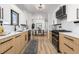 Stylish kitchen with stainless steel appliances, quartz countertops, and wood-look floors at 11241 W 60Th Ave, Arvada, CO 80004