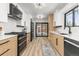 Modern kitchen featuring sleek countertops, stainless steel appliances, and lots of cabinet space at 11241 W 60Th Ave, Arvada, CO 80004