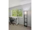 Bedroom with a desk placed in front of a bright window and carpeted floor at 3351 S Field St # 150, Lakewood, CO 80227