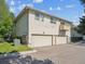 Exterior of building featuring three garage doors and an upper balcony at 3351 S Field St # 150, Lakewood, CO 80227