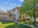 Charming townhome with well-maintained lawn and mature tree providing shade at 3351 S Field St # 150, Lakewood, CO 80227