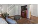 Cozy living room featuring a staircase, dark floors, and comfortable seating area at 3351 S Field St # 150, Lakewood, CO 80227