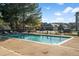 Community pool with lounge chairs and a neighborhood backdrop under a bright blue sky at 14495 E 1St Dr # C2, Aurora, CO 80011