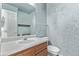 Small bathroom with single sink vanity and toilet at 672 Pitkin Way, Castle Rock, CO 80104