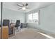 Bright bedroom with large window and ceiling fan at 672 Pitkin Way, Castle Rock, CO 80104