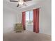 Bright bedroom with a window and comfy armchair at 672 Pitkin Way, Castle Rock, CO 80104