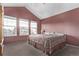 Main bedroom with vaulted ceilings and large window at 672 Pitkin Way, Castle Rock, CO 80104