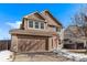 Two-story home with attached two car garage, front yard and landscaping at 672 Pitkin Way, Castle Rock, CO 80104