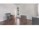 Living room with dark hardwood floors and a window at 672 Pitkin Way, Castle Rock, CO 80104