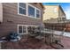 Brick patio with seating area for outdoor dining at 672 Pitkin Way, Castle Rock, CO 80104