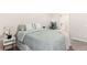 Bedroom featuring a queen-sized bed, neutral carpet, and a decorated side table at 4274 S Salida Way # 3, Aurora, CO 80013
