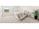 Comfortable bedroom featuring a large window, neutral carpet, and a queen-sized bed at 4274 S Salida Way # 3, Aurora, CO 80013