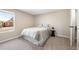 Cozy bedroom with neutral tones, a queen-sized bed, and a side table at 4274 S Salida Way # 3, Aurora, CO 80013