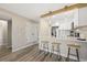 Modern kitchen with stainless steel appliances, quartz countertops, and breakfast bar seating at 4274 S Salida Way # 3, Aurora, CO 80013