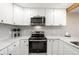 Contemporary kitchen showcasing stainless steel appliances, ample counter space, and modern finishes at 4274 S Salida Way # 3, Aurora, CO 80013