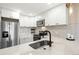 Bright kitchen features stainless steel appliances, subway tile backsplash, and white cabinetry at 4274 S Salida Way # 3, Aurora, CO 80013