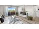 Inviting living room with electric fireplace, balcony access, and adjacent bathroom entrance at 4274 S Salida Way # 3, Aurora, CO 80013