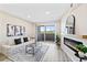 Bright living room with modern fireplace, sliding glass doors, and neutral decor create an inviting atmosphere at 4274 S Salida Way # 3, Aurora, CO 80013