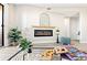 Cozy living room with sleek electric fireplace, complemented by stylish decor and natural light at 4274 S Salida Way # 3, Aurora, CO 80013