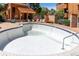 Empty outdoor pool with lounge chairs and fenced perimeter at 4274 S Salida Way # 3, Aurora, CO 80013