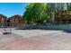 Outdoor tennis and basketball court surrounded by trees and landscaping at 4274 S Salida Way # 3, Aurora, CO 80013