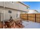 Cozy backyard space with a wooden fence, seating and a fire pit at 1244 S Reed St # 2, Lakewood, CO 80232