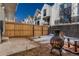 Private fenced backyard offering a relaxing outdoor space with seating and a fire pit at 1244 S Reed St # 2, Lakewood, CO 80232