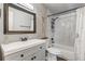 Modern bathroom with marble tile surround, vanity, and shower with modern hardware at 1244 S Reed St # 2, Lakewood, CO 80232
