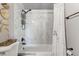 Stylish bathroom with white marble tiling surrounding the tub and shower at 1244 S Reed St # 2, Lakewood, CO 80232