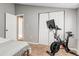 Comfortable bedroom with fitness bike and open closet space at 1244 S Reed St # 2, Lakewood, CO 80232