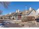 Street view of a residential townhome featuring modern design and convenient parking at 1244 S Reed St # 2, Lakewood, CO 80232
