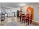 Bright kitchen and dining area with a view of stainless appliances and plenty of seating at 1244 S Reed St # 2, Lakewood, CO 80232