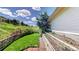 Side yard with a fenced-in garden area and lush green lawn at 7084 Fox Paw Trl, Littleton, CO 80125