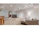 Finished basement area with a comfortable sitting area, kitchenette, and dining table at 7084 Fox Paw Trl, Littleton, CO 80125
