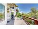 Outdoor deck featuring seating and picturesque views of the lush, green hillside at 7084 Fox Paw Trl, Littleton, CO 80125