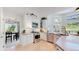 Bright kitchen with stainless steel appliances, white cabinetry, and a breakfast bar at 7084 Fox Paw Trl, Littleton, CO 80125