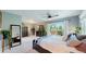 Spacious main bedroom with a walkout balcony, comfortable bedding, and stylish decor, creating a luxurious retreat at 7084 Fox Paw Trl, Littleton, CO 80125