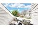 Comfortable balcony seating area, perfect for relaxation, with neighborhood views at 8701 Huron St # 1-207, Thornton, CO 80260