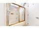 Bathroom featuring a bathtub with sliding glass door at 8701 Huron St # 1-207, Thornton, CO 80260