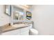 Well-lit bathroom featuring a granite countertop vanity and modern fixtures at 8701 Huron St # 1-207, Thornton, CO 80260